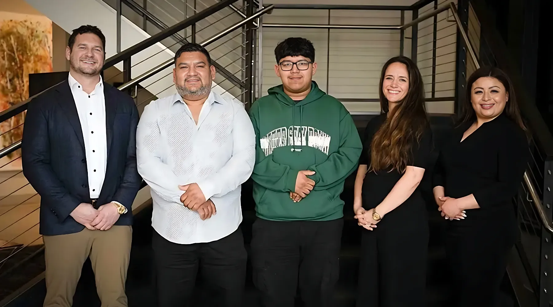 Seattle Injury Law team posing with clients after $2.5 million car settlement win