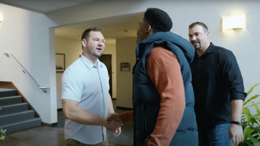 founding attorney Robert Sears shaking hands with a client